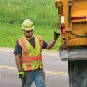 Worker behind truck